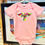 Thumbnail: Mexican Otomi Bird Embroidered Light Pink Baby Onesie