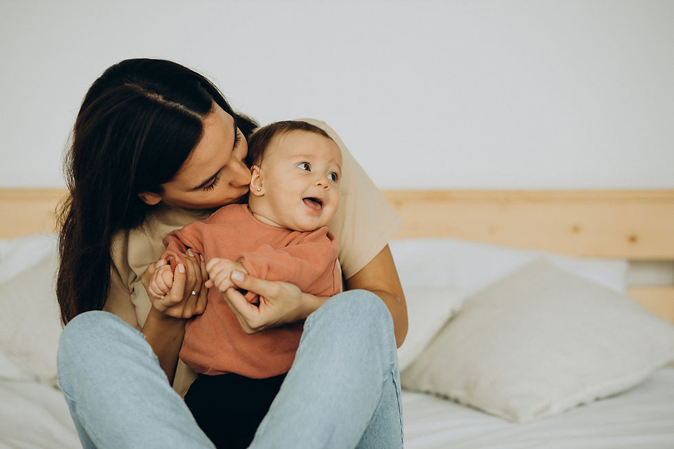 mother-with-baby-daughter-lying-bed.jpg