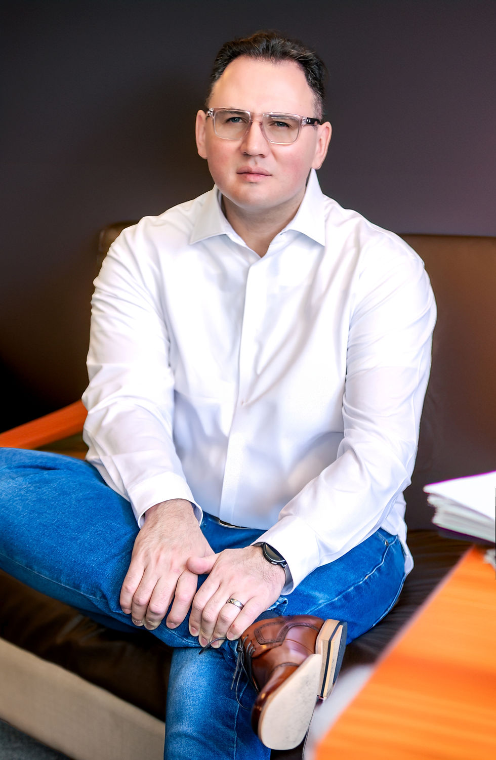 Professional photo of Iulian Ungureanu, LCSW, online therapist specializing in couples counseling, men’s mental health, and parenting support.