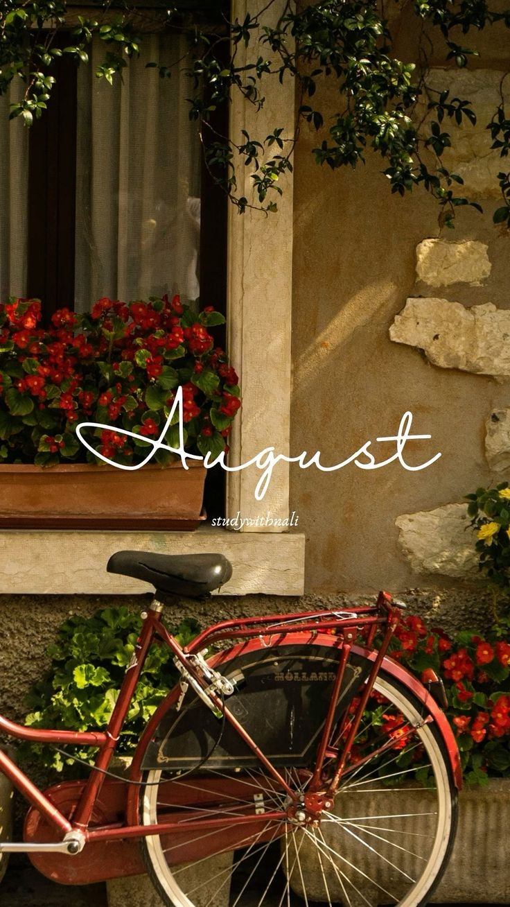 Cozy August aesthetic featuring a vintage red bicycle beside a flower filled window with lush greenery and warm sunlight, creating a peaceful late summer atmosphere.