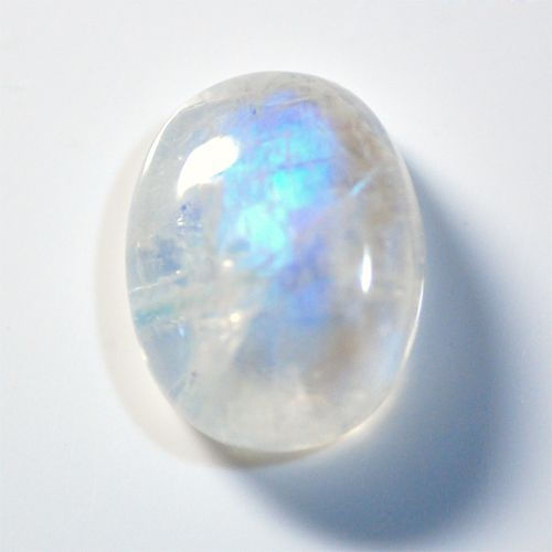 Rainbow moonstone gemstone with blue iridescence, representing intuition and new beginnings for Libra New Moon rituals.