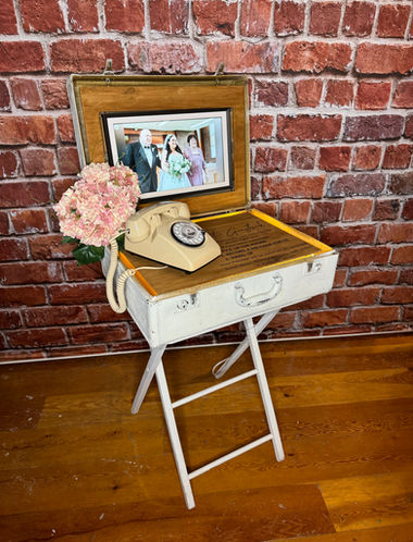Suitcase table with slideshow and audio guestbook