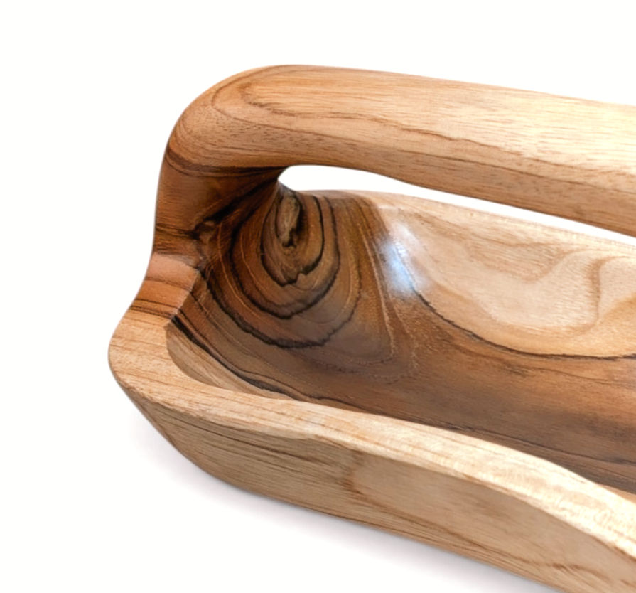 Thumbnail: Close angled view of teak organizer showing knots and flowing grain