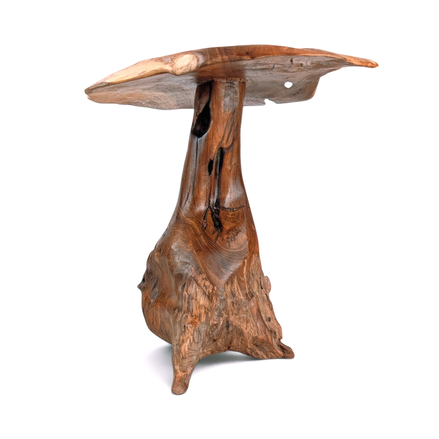 Small hand-carved teakwood garden sculpture with a rounded cap and organic base