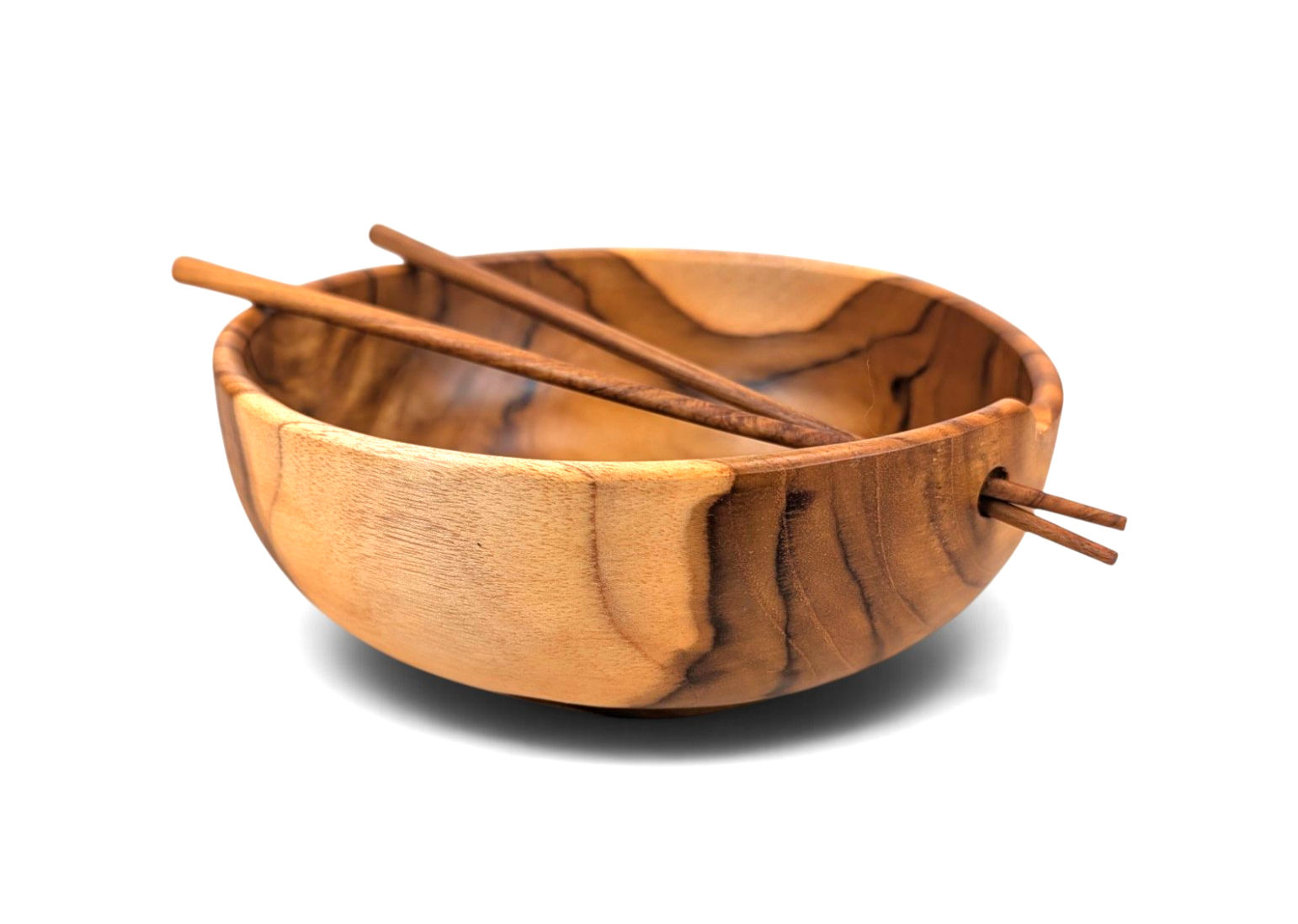Close-up angle of the interior of a natural teak noodle bowl, showing the swirling patterns and warm honey-brown wood tones.