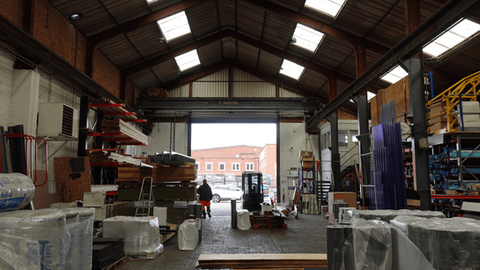 inside the leicestershire branch showing roofing products and a fork lift truck