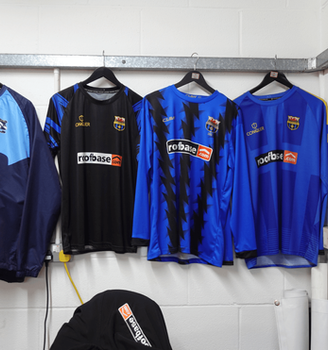 Roofbase football shirts as sponsor on display at roofbase swansea 