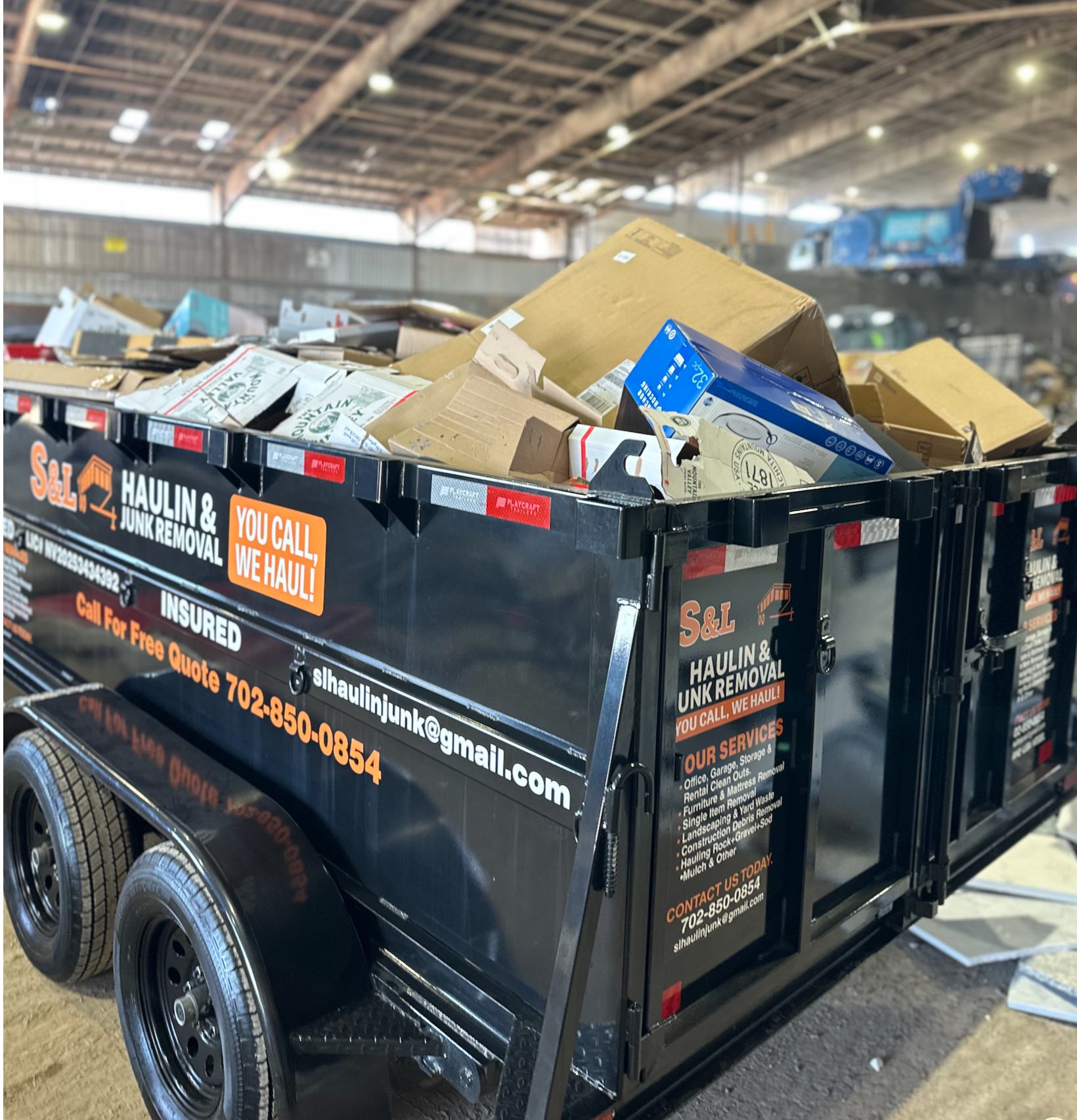 Junk removal in Las Vegas with trailer loaded with household debris at transfer station