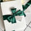 Thumbnail: Eden Boxed with luxury bow greenery belly band invitation