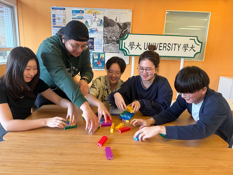 Maisie (middle) and her friends enjoying board games—demonstrating how friendships extend beyond orientation camps