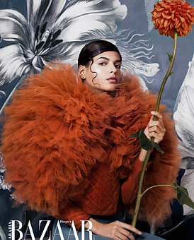 Model with orange Tulle Top and flower