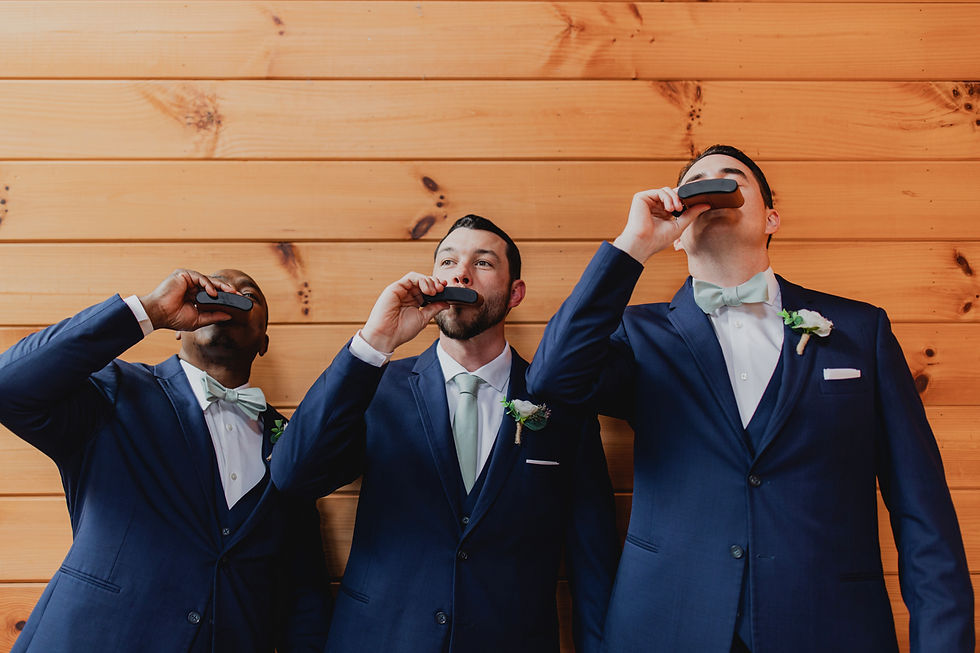 Groom and groomsmen having a drink