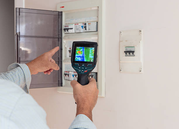 commercial electrician inspecting with infrared scan