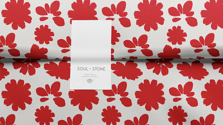 Floral tissue paper featuring Soul and Stone branding; red flowers and white background.