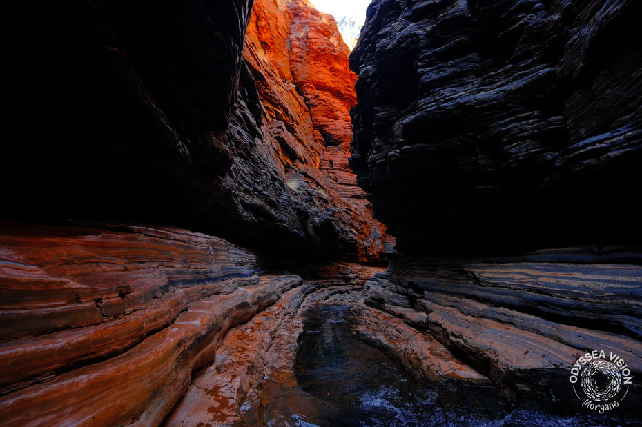 Red rock gorges of Karijini National Park seen from inside the gorge, capturing the park’s rugged landscapes and natural beauty.