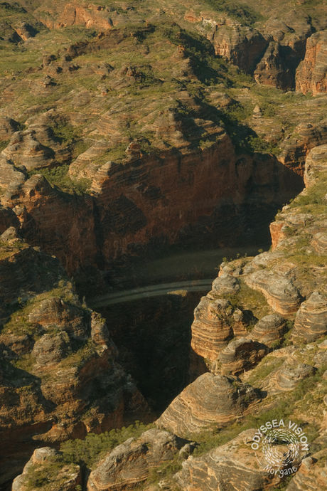 Helicopter view of Purnululu National Park in Western Australia, featuring the iconic Bungle Bungle rock formations and surrounding natural scenery.