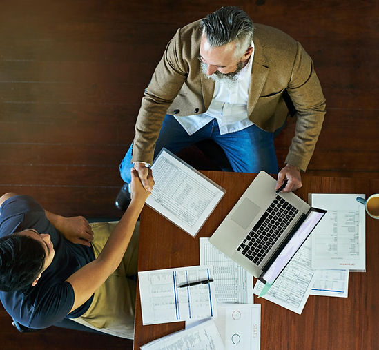 Accountant reviewing financial documents with client