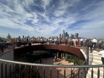 A wide angle shot of a rooftop with views over central London