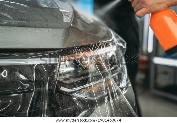 process-installing-paint-protection-film-600w-1901463874.webp