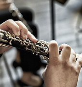 closeup-of-a-person-playing-the-oboe-indoors-2025-02-02-13-15-38-utc.jpeg