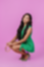 melissa-wildmelidesignstudio-branding-and-website-in a green outfit, long hair and a crown