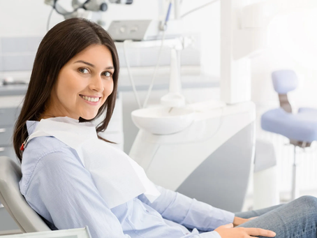 lady sitting in dental chair in office