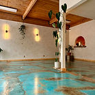 By Amber Ford, The Mountain Times It’s not often that The Mt. Hood Villages gets excited about new businesses and events in this small corridor, but residents and neighbors are on pins and needles with the grand opening of Vinyasa Casa. Located in the back of the Thriftway plaza, Vinyasa Casa will not only house a variety of different yoga classes, but will also host a number of exciting community events inspired by the needs and wants of The Mt. Hood Villages. Owner and massage therapist Kristi Carson, along with her partner, Christopher, decided last year to expand the massage business. They created a plan that speaks to their passions relative to self-care and movement, and encourages community members to do the same. “Chris and I have talked about the different ways we could grow with our community while celebrating our strengths and learning new things,” Carson said. “We’ve always been attracted to movement arts and wellness, so living here it was easy to see that there was space for a community wellness and fitness space to thrive,” Carson added. A resident of The Mt. Hood Villages for the last decade, Carson has been involved in the wellness industry for the last 18 years. Her career began as a licensed esthetician, specializing in holistic skincare and sugaring, but she found her true passion in the overall care of the body and the natural flows that allow it to thrive. A licensed massage therapist for over 15 years, her professional calling is the care of others through touch and healing. “What I do isn’t just massage: I am a muscle mechanic,” Carson said. “I have a passion for pain management, primarily through myofascial release, while maintaining spa vibes. I’ve been trained in many modalities, but my favorites are myofascial release, Thai massage (which I studied in Thailand) and Sarga (a myofascial release technique using my feet),” she added. Her passion for transforming the body is both a new business venture and a way of giving back to her community. Carson and Christopher have high expectations for Vinyasa Casa. Offering a variety of different physical arts, the overall theme of Vinyasa Casa caters to just about everyone with a desire to move. “We think the possibilities for the space are limitless, but we plan to always offer yoga, Pilates, and movement art, as well as host social nights like cards, chess, and dancing,” Carson said. “Our vision is to connect with the community in a healthy and uplifting way.” With years of artistic experience, training, and a desire to strengthen the community, both Carson and Christopher dove headfirst into the renovation process, handling most of the hard work and labor themselves. Using the space as their canvas and their vision as the brush, Carson and Christopher were able to transform the space into a unique community hub, with the help of friends and neighbors. “We had help from our friends, family, and neighbors, and we could not have done it without them,” Carson said. “Vinyasa Casa is truly a product of the dedication of two local artists wanting to create a feel good, high vibration place to share with our beloved mountain family, friends, and visitors.” Although Carson and Christopher have the same overall goal for the facility, they have different emphases in the creation of Vinyasa Casa. “Chris and I are excited about different things,” Carson said. “I am most excited to connect with people, to have fun and to share wisdom and create art and connection. He's obviously most excited that we’ve created a beautiful place to exercise and practice yoga right here in the heart of the community.” Currently open and operational, Vinyasa Casa’s schedule of classes and events can be found on their website, thevinyasacasa.com . Eager to share their holistic home – their space, skills, and artistic gifts – with The Mt. Hood Villages, Carson and Christopher are excited to be up and running. “We hope you like what we’ve built and enjoy the experiences and lessons these amazing humans want to share with us,” Carson said. "It’s an honor to gather together and share in the experience we call life,” Carson added.