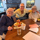 By Marie Kennedy, The Mountain Times Plates filled, coffee poured, and raffle tickets in hand, 75 community members turned out Sunday, April 12, at Alpine Events to support the Hoodland Senior Center and its Meals on Wheels program. Guests were treated to a buffet-style breakfast served from 10 a.m. to 1 p.m., featuring a wide variety of offerings, including eggs and traditional breakfast fare, fresh green salad, fruit, scones, biscuits and more. Attendees described the meal as plentiful and well-prepared, thanks to Alpine Events owners Dani Wolfe and Tony Kelner. The room was abuzz with friendly chatter and laughter. “Ooh, I’ve got a little bit of everything,” said one guest as she set her plate on the table. “The food is amazing - and so is the coffee,” said another with a smile. The senior center’s new director, Laura Peterson, said, “We’d like to give a big shoutout to Dani and Tony for the amazing brunch and the wonderful hospitality. And of course, big thanks to the volunteers this month who made this event so successful.” Proceeds from the fundraiser will go directly toward supporting the center’s Meals on Wheels program, which provides daily meals to seniors throughout the Hoodland area. The program serves older adults across a broad stretch of the mountain community, from Alder Creek to Government Camp. Designed to assist seniors who may be unable to shop or prepare meals due to age, illness, or disability, the service also helps support working families by ensuring their loved ones receive regular, nutritious meals. The Hoodland Senior Center currently delivers approximately 40 meals to homebound seniors, with no required fee, though donations are accepted. Leita Bibler-Thomas, Assistant Director, handles the logistics of getting those meals out. “Meals on Wheels visits are an opportunity to check on some of our seniors, to make sure they get a hot meal at least once a day.” Founded in 1976, the Hoodland Senior Center grew from a small community effort into a vital local resource. What began as potluck gatherings organized by volunteers, including Reva Cox and Louise O’Dea, quickly expanded into a formal program offering meals, services, and social opportunities for area seniors. The organization earned nonprofit status in 1993 and continues to serve as a hub for community connection. Today, the center’s mission remains focused on supporting healthy, active lives for seniors and people with disabilities by providing access to nutrition, health resources, and social engagement. The morning unfolded with full plates, easy conversation and a steady flow of neighbors. It was a clear show of support for the Hoodland Senior Center and the services it provides.