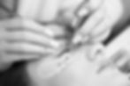 Beautiful female face during lash extension procedure in salon_edited.jpg