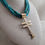 Thumbnail: Hand Rolled Royston Turquoise Bead Necklace with 14K Pueblo Cross Pendant