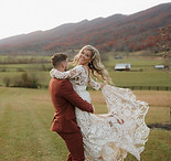 crooked river wedding venue Virginia. boho bride and groom laughing.