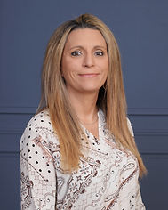 Aleta Brochue Head Shot - Blue Background.JPG