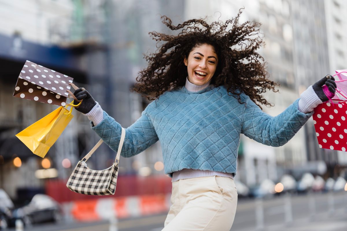 Strategies to Nurture Your Clients - woman happy after buying on offer