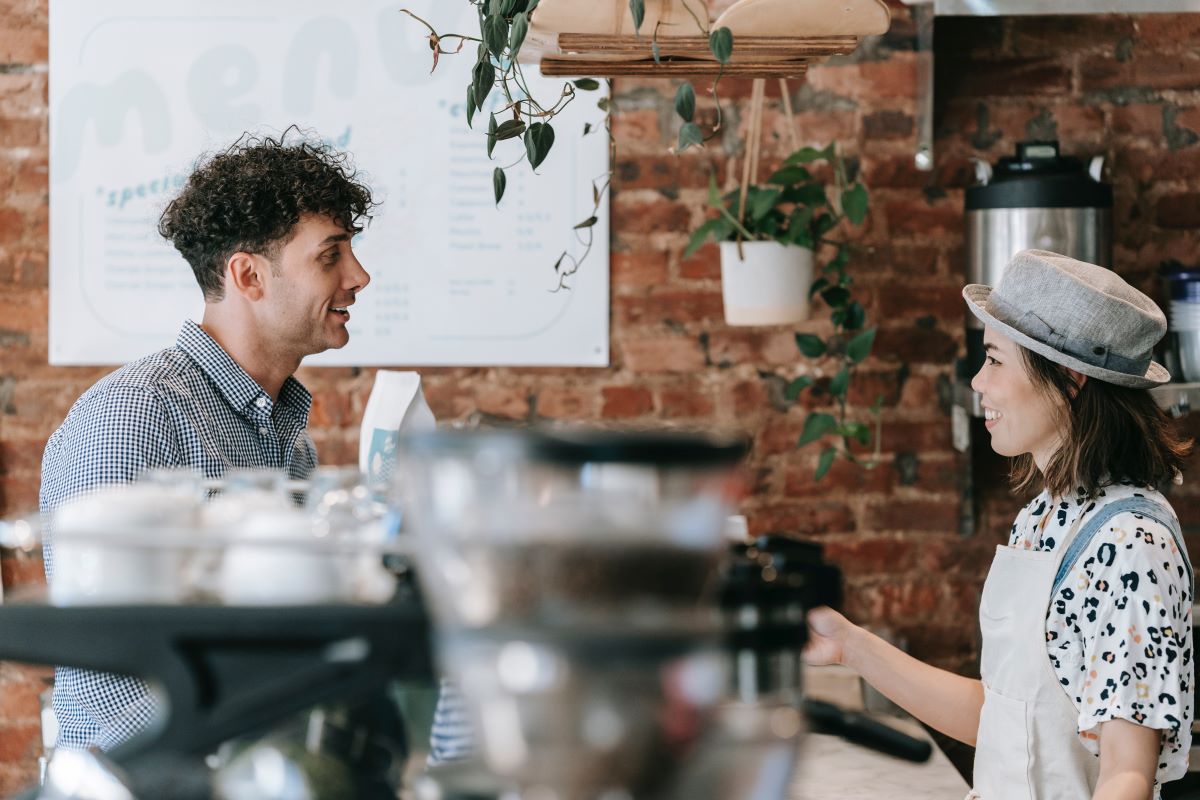Strategies to Nurture Your Clients - coffee sales woman talking to client