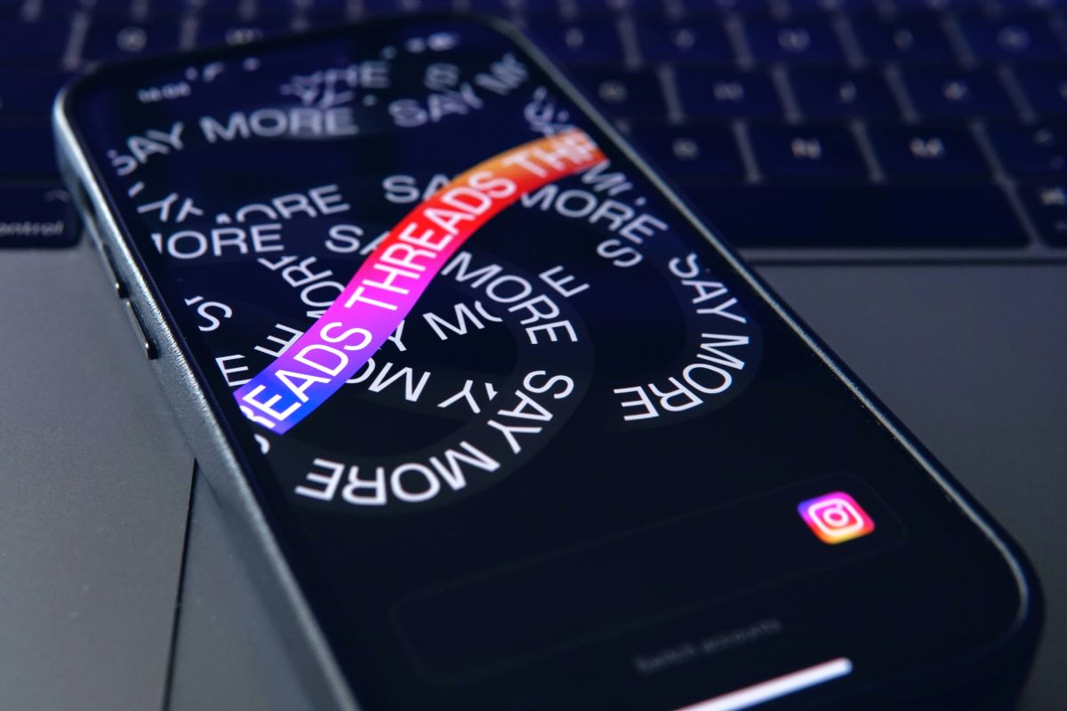 How to Create Instagram Threads - mobile phone with threads logo