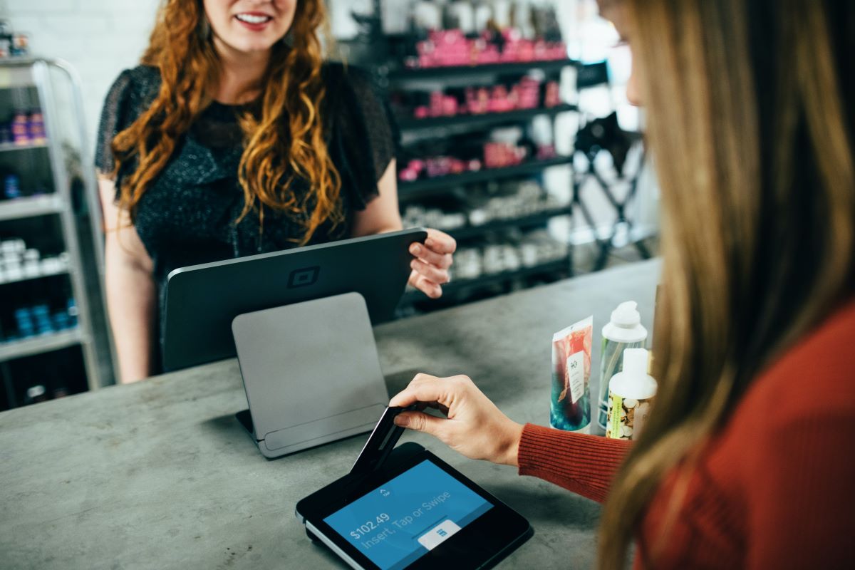 How to Build Relationships with Your Customers - woman gifting a loyal customer