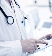 Doctor Using Digital Tablet