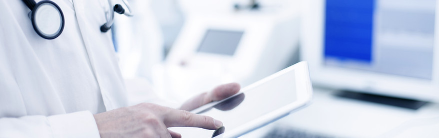 Doctor Using Digital Tablet