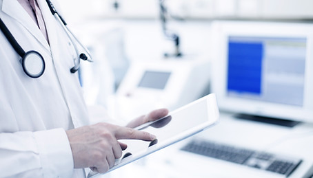 Doctor Using Digital Tablet