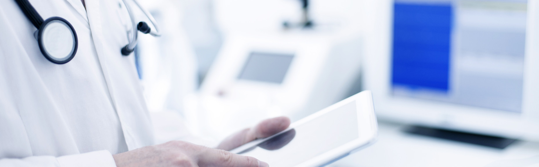 Doctor Using Digital Tablet