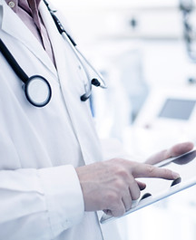 Doctor Using Digital Tablet