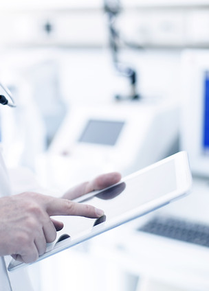 Doctor Using Digital Tablet