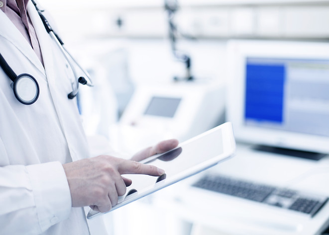 Doctor Using Digital Tablet