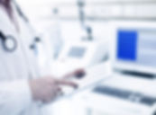 Doctor Using Digital Tablet
