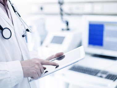 Doctor Using Digital Tablet