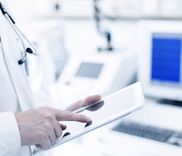 Doctor Using Digital Tablet