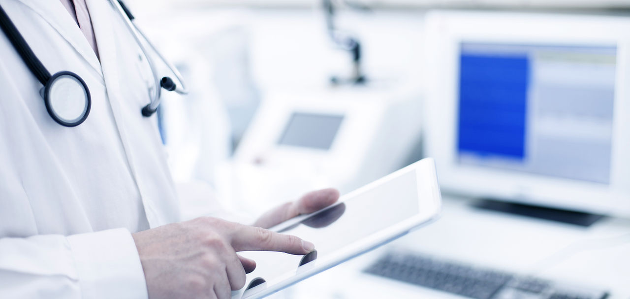 Doctor Using Digital Tablet