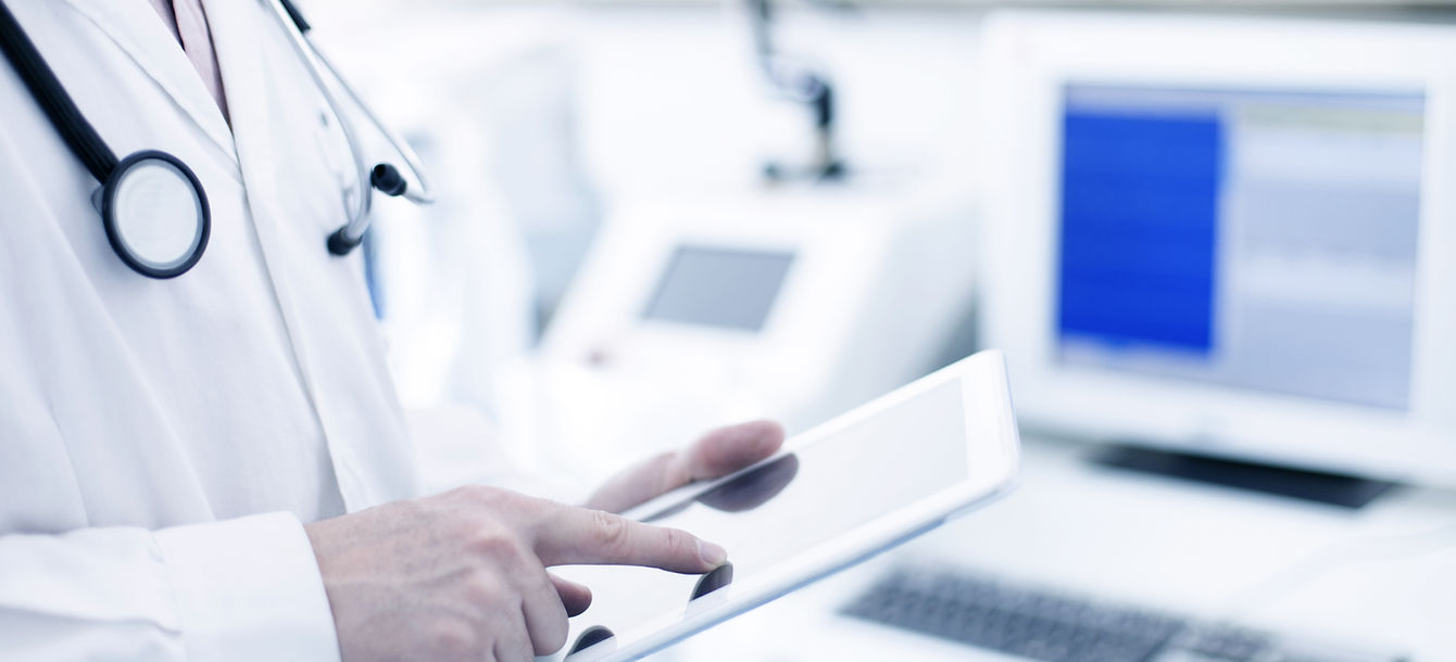 Doctor Using Digital Tablet