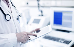 Doctor Using Digital Tablet