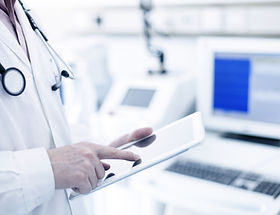 Doctor Using Digital Tablet